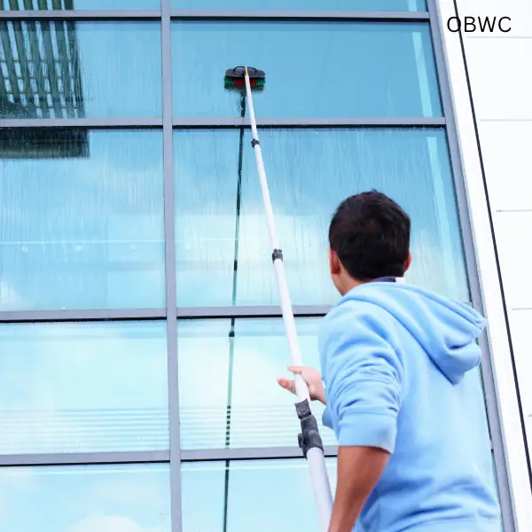 OBWC man using water fed pole close up
