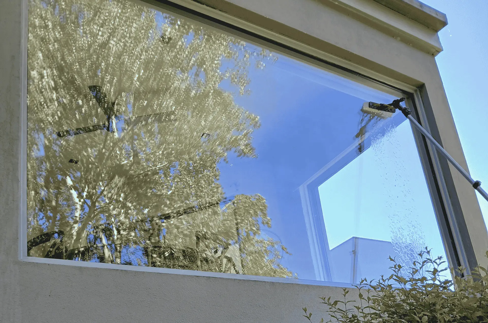 Single large picture window and water fed pole